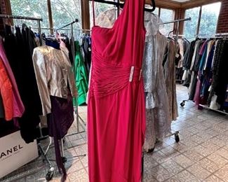 Red cocktail dress with crystals.  The homeowner is 99% sure this is Valentino Couture.