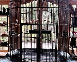 MONUMENTAL custom bird cage!  This bird cage is in the shoe and handbag room if you want to see it.  We are using it for display of scarves and hats at the sale