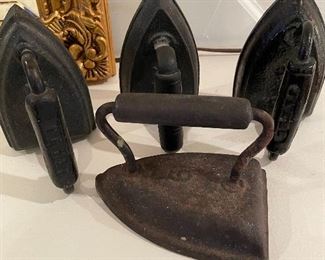 Antique flatirons, 2 marked Bama