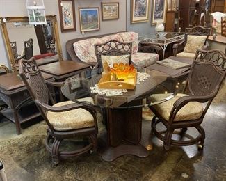 Very nice Rattan made by ACACIA HOME and GARDEN, Inc., Conniver, NC. This set has casters on the chairs and a very nice, heavy base, and a glass top