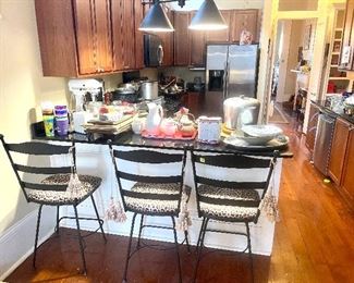 three barstools with leopard seats