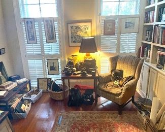 the library contains vintage camera equipment, and Escher print, and a pair of "tourist" watercolors... and more!