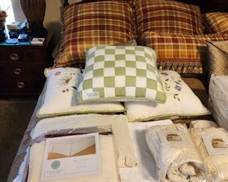 lots of bedspreads and pillows