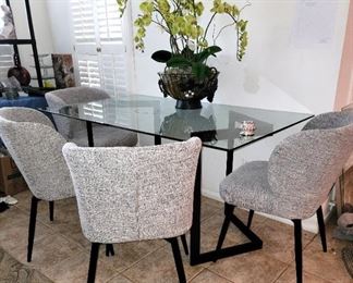 Dinette: Glass top table with 4 new swivel chairs 