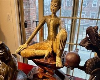 Dreamy carved wood Buddha on wood bench (sold separately).