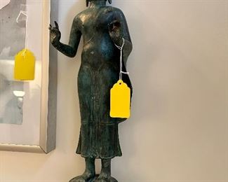 Bronze standing Buddha.