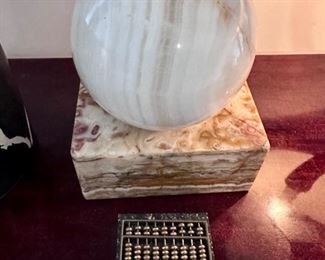 Stone sphere on block sculpture.