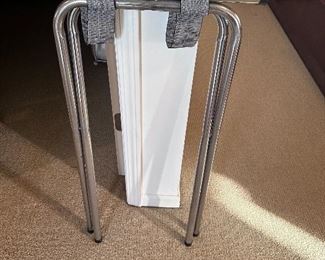 Metal folding luggage rack.