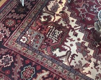 Large wool rug in dining room.