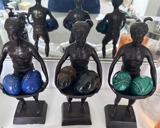 Cast metal servant figures & stone eggs.