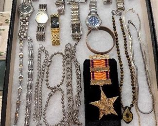 Assortment of men's watches and jewelry.