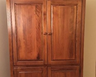 Cherry Entertainment center - or use it as a pantry or storage cabinet.
