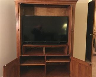 Cherry Entertainment center - or use it as a pantry or storage cabinet.