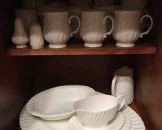Minton "White Fife" china (197 pieces), made in the UK in 1968
10 ½” dinner plates: 20
8” luncheon plates: 20
6 ¼” dessert plates: 20
5 ½” saucers: 30
Relish bowls with plates: 2
5 ¼” bowls: 19
6 ½” bowls: 11 Minton, 8 Royal Crown (?) replacements
8 ¾ x 5” Kidney-shaped Plates: 12
8 ¾ x 9 ¾ serving plates: 2
8 ¼  serving bowl: 1
12 x 6 rectangular serving tray: 1
8 ½ x 5 ¼ oval serving dish: 1
10 x7 ½ serving bowl: 1
8 x5 ½ gravy boat: 2
4 x 3” deep pitcher: 1
3 x 2 ¼” deep pitcher: 1
Salt & pepper: 2 sets
2” bowl: 1
10 x 7 ¼ serving bowl: 1
17 ¾ x 14 serving platter: 1
15 ¼ x 12 serving platter: 1
4 x 3 ½ x 5 ¼ deep pitcher: 1
GHA mugs: 4
Tea cups: 30
Tea pot: 1
Coffee pot: 1