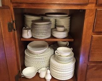 Minton "White Fife" china (197 pieces), made in the UK in 1968
10 ½” dinner plates: 20
8” luncheon plates: 20
6 ¼” dessert plates: 20
5 ½” saucers: 30
Relish bowls with plates: 2
5 ¼” bowls: 19
6 ½” bowls: 11 Minton, 8 Royal Crown (?) replacements
8 ¾ x 5” Kidney-shaped Plates: 12
8 ¾ x 9 ¾ serving plates: 2
8 ¼  serving bowl: 1
12 x 6 rectangular serving tray: 1
8 ½ x 5 ¼ oval serving dish: 1
10 x7 ½ serving bowl: 1
8 x5 ½ gravy boat: 2
4 x 3” deep pitcher: 1
3 x 2 ¼” deep pitcher: 1
Salt & pepper: 2 sets
2” bowl: 1
10 x 7 ¼ serving bowl: 1
17 ¾ x 14 serving platter: 1
15 ¼ x 12 serving platter: 1
4 x 3 ½ x 5 ¼ deep pitcher: 1
GHA mugs: 4
Tea cups: 30
Tea pot: 1
Coffee pot: 1