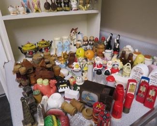 A large collection of salt and peppers shakers.
