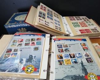 Several books of collectible stamps.