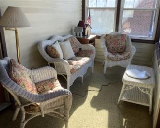 Four piece wicker set with pads.  Loveseat $75, chairs $45, coffee table $35