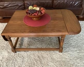 Drop leaf oak coffee table .  Measures 30 “ long x 24” w x 15” h.  Presale $60