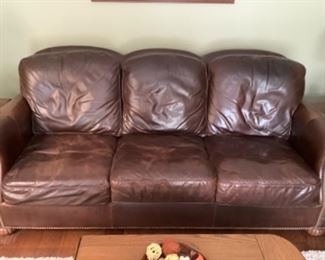 Legacy leather brown sofa measures 83l x 39 d x 34 h.  Presale 375.   Has matching chair and ottoman