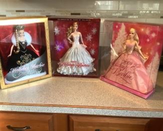 Holiday Barbie dolls…still new in box.  2006,7,8,9,14,15
