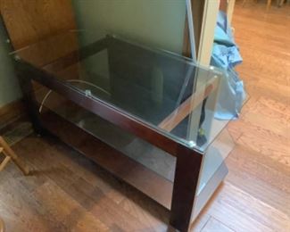Glass top and shelf tv stand for flat screen.