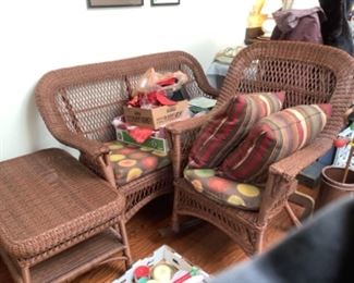 Brown wicker set with loveseat, rocker and coffee table.  Presale $150 for three pieces.