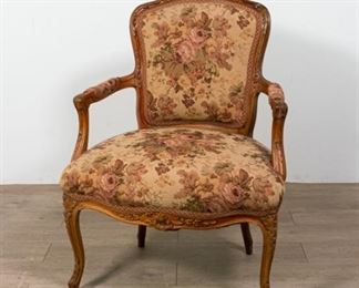 5	Carved Walnut Upholstered Open Arm Chair	Walnut upholstered open arm chair with carved top, arms and feet. 36" H X 26" W X 18" D
