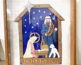 Large needlepoint nativity that is framed in a shadowbox