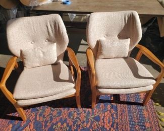 Pair of MCM inspired club chairs. Very good condition, some minor scratches on legs.
Attractive MCM style wood frame club chair with sand color upholstery. Well padded seat and backs are very comfortable. Includes lumber pillows.
Dimensions: 32.75"H x 25.75"W x 30.25"D
Seat: 17.5"H x 20.3"W
Materials: fabric/wood