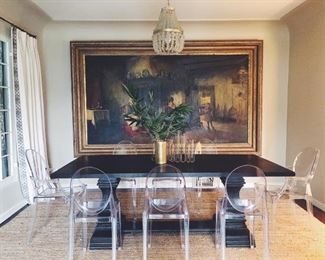 Ghost chairs and pedestal dining table.
