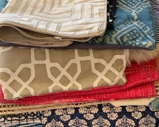 Stacks of throw pillow covers.