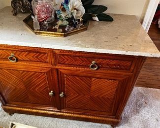 Antique marble topped 2 door cabinet. Parquet wood pattern throughout 