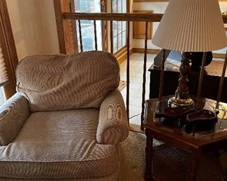 Easy chair, glass topped table, vintage lamp