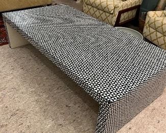 Large geometric coffee table.  Such a conversation piece.  it is Navy and White.  There is one tiny triangle piece missing on the corner, only slightly noticeable.