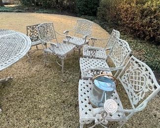 Metal round table with six matching chairs.