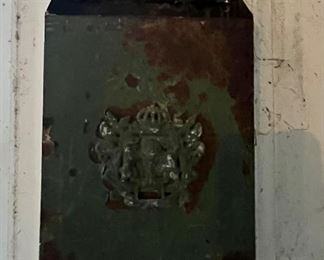 Vintage mailbox/newspaper holder.  Located in garage on wall.