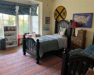 These twin beds are SOLID.  They do not rock or hit the wall.  They are high quality beds!