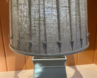 These adorable shelf lamps are heavy.  The linen shade has cute "button" knobs around the bottom of the shade.