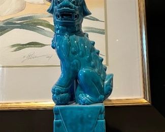 A pair of ceramic Asian Foo Dog statuettes.