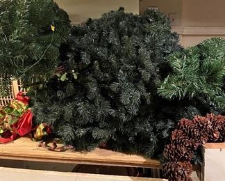 Various Christmas wreaths.  Some with lights, some without.