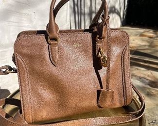 Not sure why this photo of this Alexander McQueen leather purse looks grainy in this ad, because it is absolutely flawless and gorgeous.  