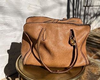 Same with this Alexander McQueen bag.  The original photo is perfect, so not exactly sure why it is showing up grainy on this ad.  You must see to believe.   **This one has a broken strap, but can be repaired by a cobbler.**