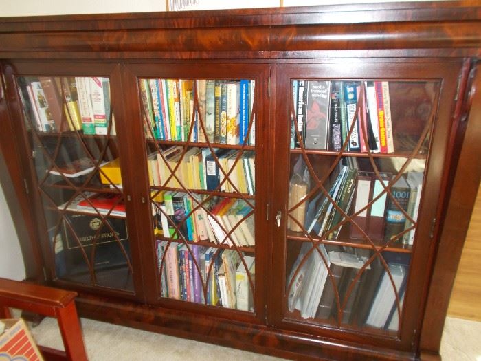 Triple door  ornate bookcase with hidden drawers