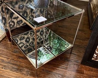 Pretty little side table with glass top and mirrored bottom