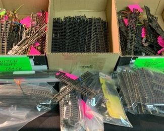 HO scale train track (straight, curved, switches left and right, intersections, smaller pieces, etc.). For sale individually or as a lot.