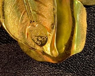 “Original by Robert” collectible pin.