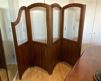 Vintage Parisian Wood & Beveled Glass Four Paneled Screen on casters. 