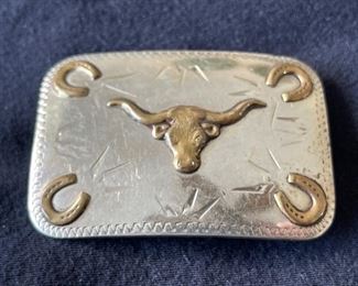 Cowboy belt buckle. https://www.liveauctioneers.com/catalog/274244