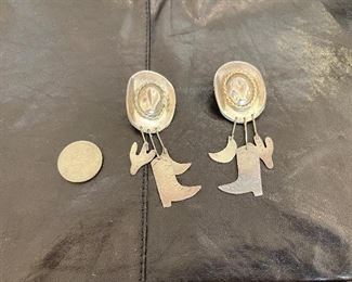 Silver earrings.  https://www.liveauctioneers.com/catalog/274244